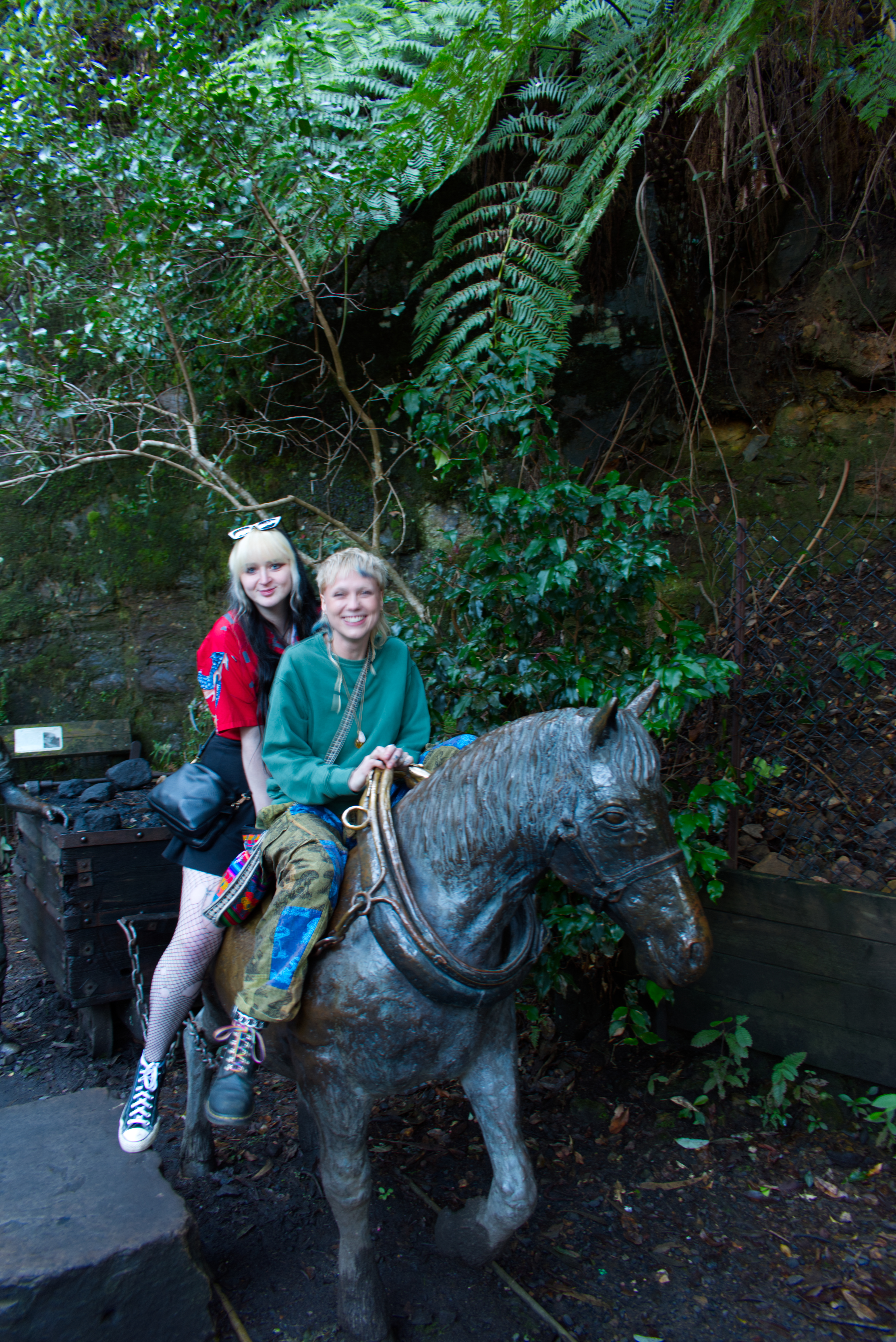 Charlotte and Brook on a metal horse